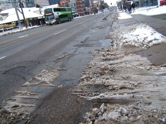 Driveway
tracking snow across the bike lane.