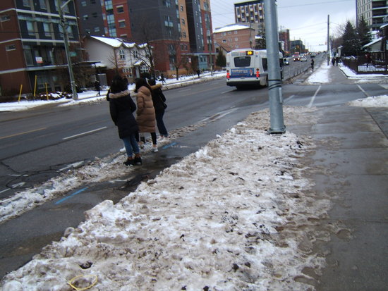 People standing in the bike lane