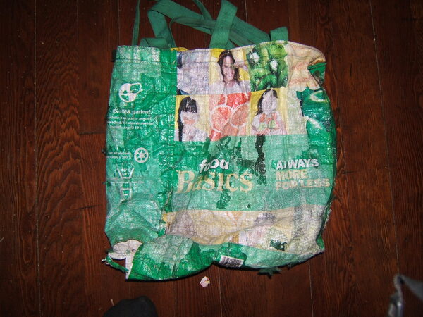 Degraded Food Basics bag, side one. There is a tear at the bottom
and half the bag has worn off.